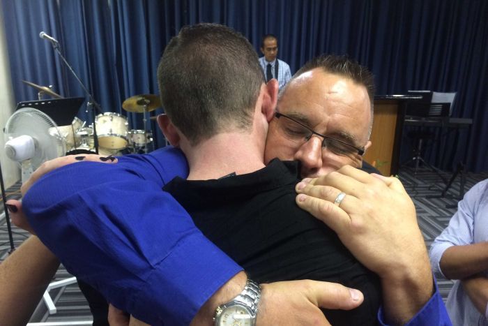 Father hugs driver accused of Christmas Day crash that killed his son