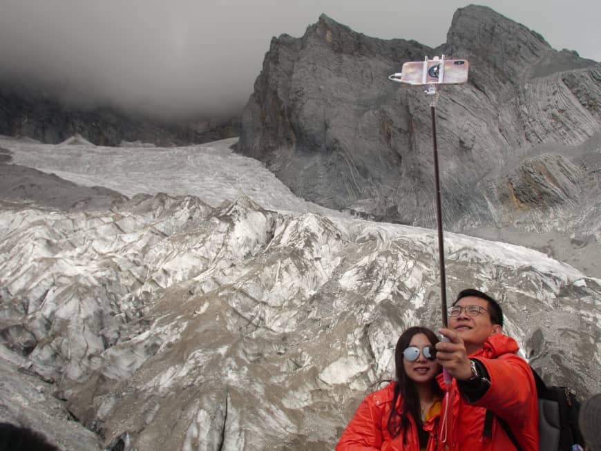 Melting Baishui glacier in China draws millions of tourists and scientists’ fears
