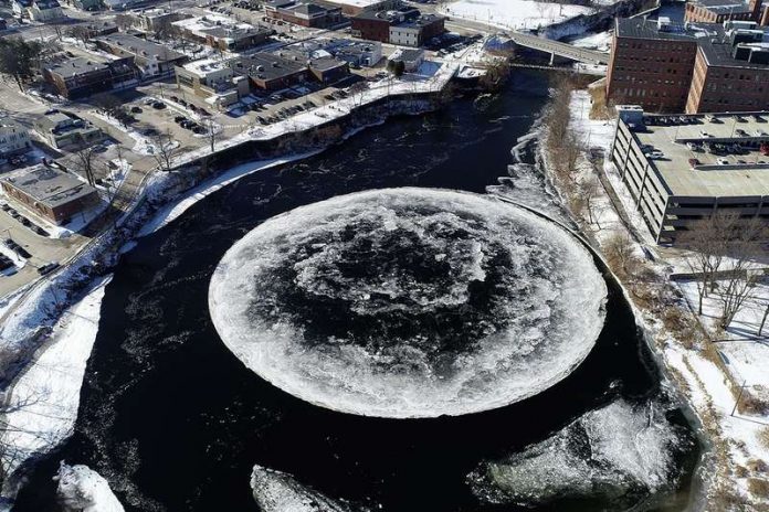 Spinning ice disc forms in Maine river (Watch)