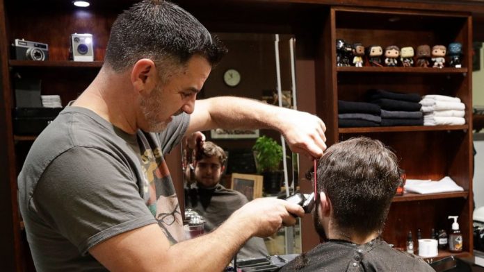 Coronavirus updates: New Zealand barber snips away at midnight as nation reopens