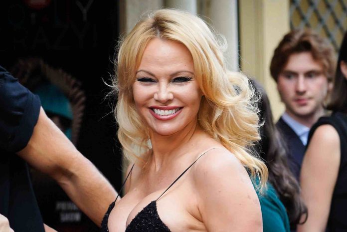 Actress Pamela Anderson Takes PPE to the Airport