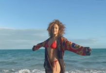 Watch: Jennifer Lopez WOWS in red bikini as she performs yoga on beach