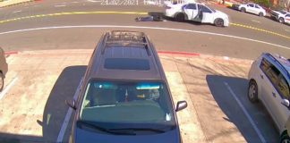 CCTV captures woman being dragged along road by robbers in car (Video)